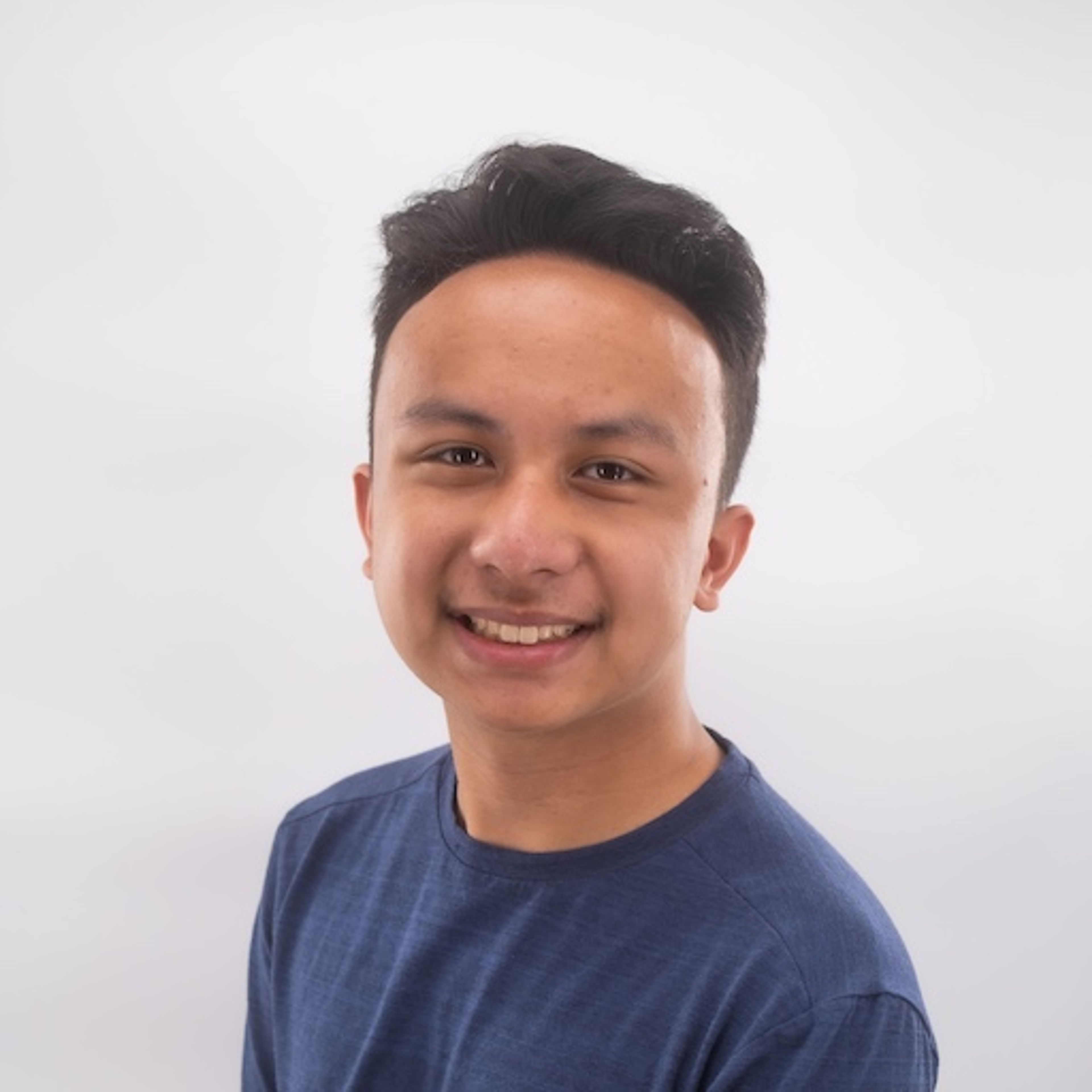 A professional studio picture of Kyle Awayan